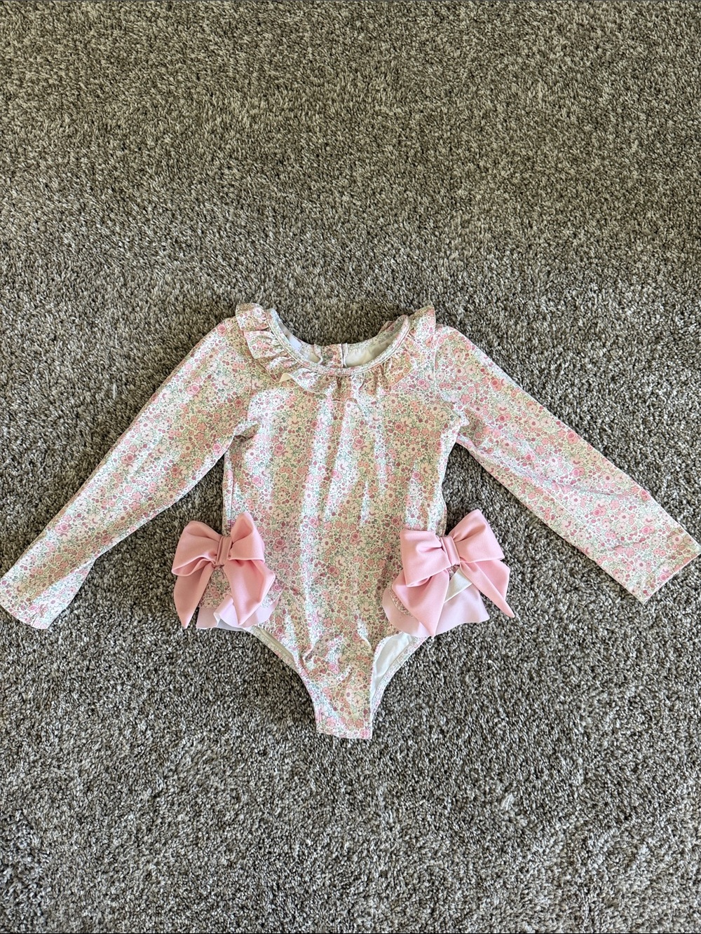 Long-Sleeve Pink Floral One-Piece Swimsuit with Decorative Bows